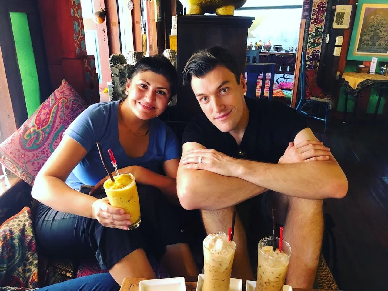 Jaylene and Aaron seated together at a table in Chiang Mai